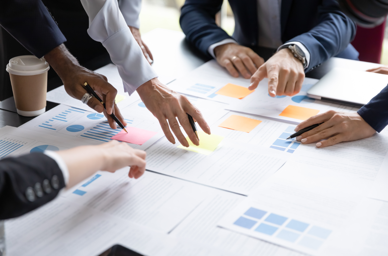 People working over a spreadsheet